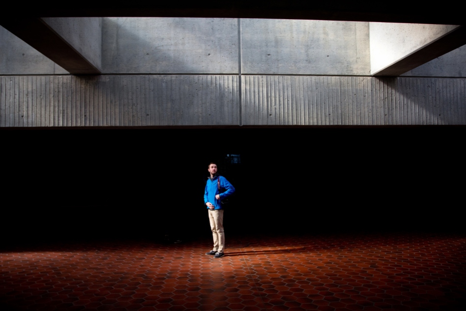 Photojournalism student Chris Bacarella waits at the Metro Station.